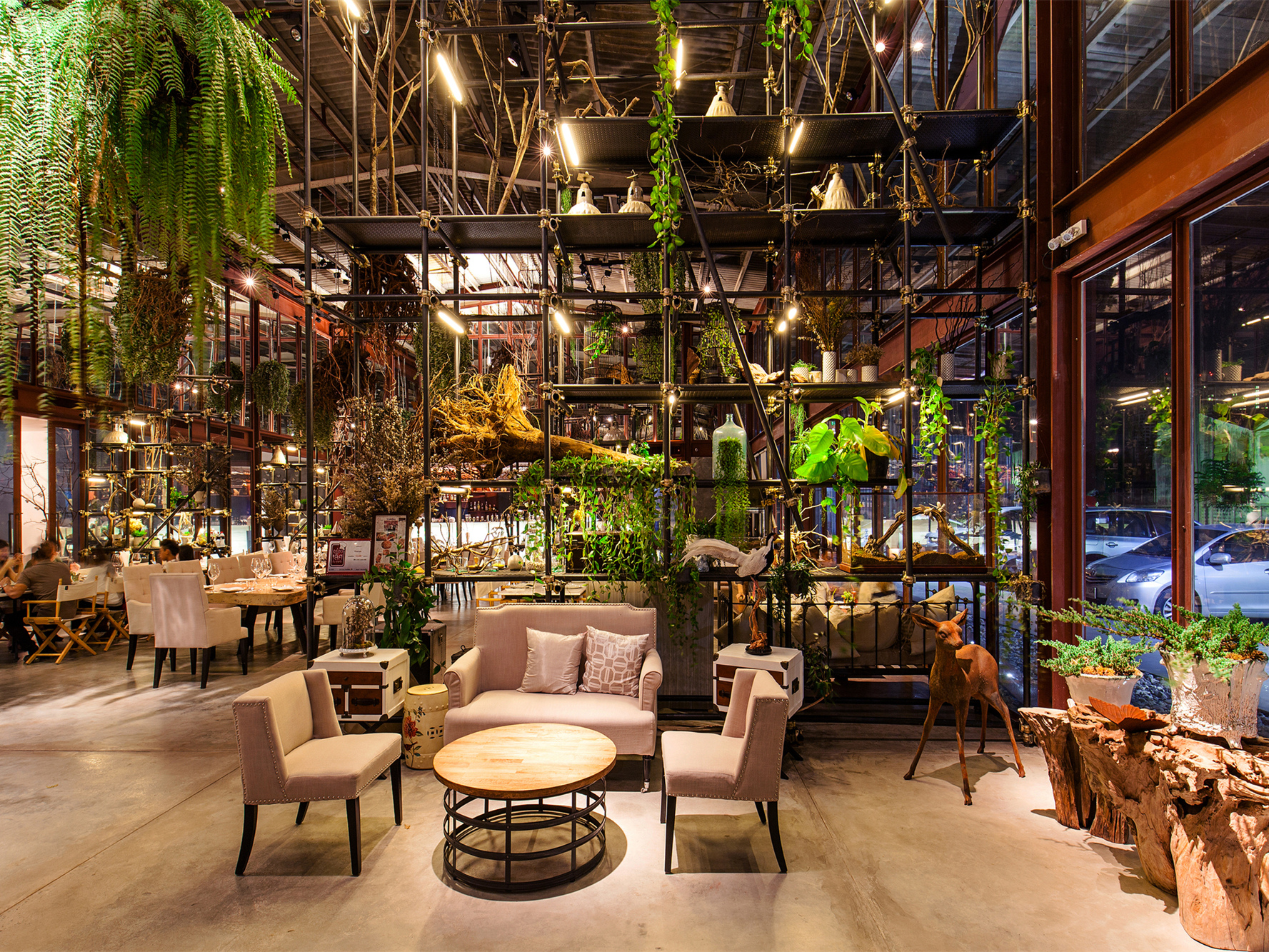 Tailand Bangkok Vivarium restaurant furniture_round wood restaurant table and nails decor fabric sofas