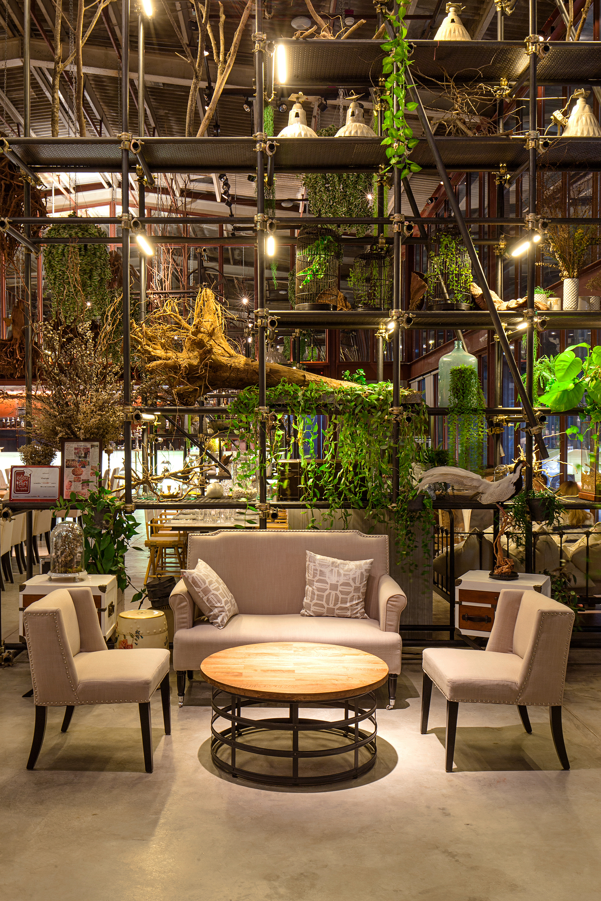Tailand Bangkok Vivarium restaurant furniture_round wood restaurant table and nails decor fabric sofas
